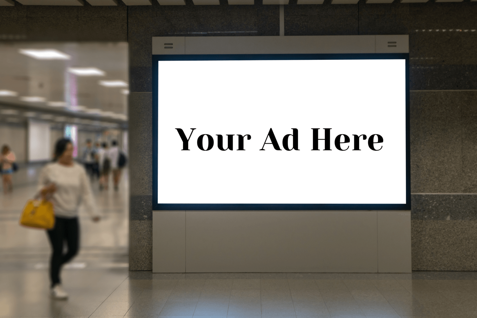 station with people walking around a large screen that says "your ad here".